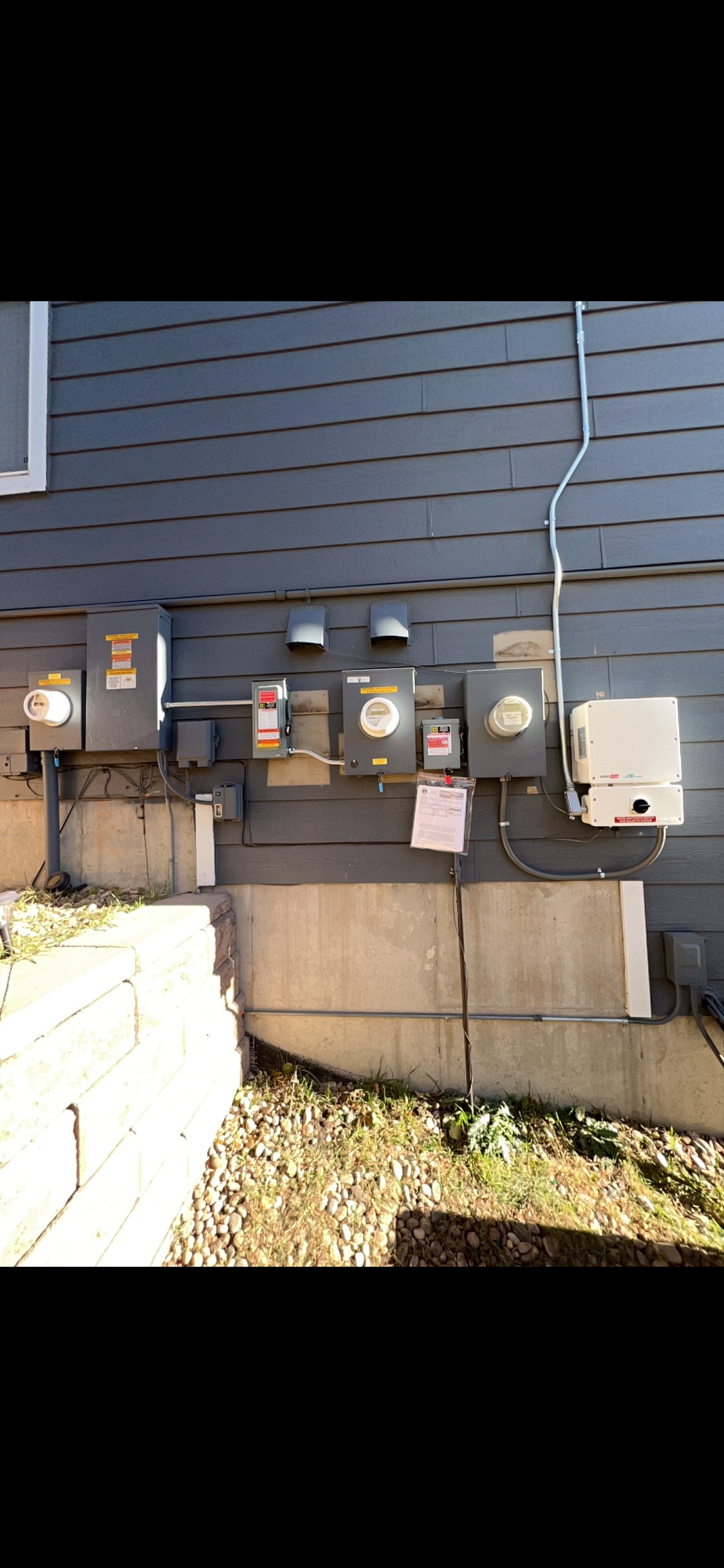 Certified electrician installing electrical panel for a home in [City, State]