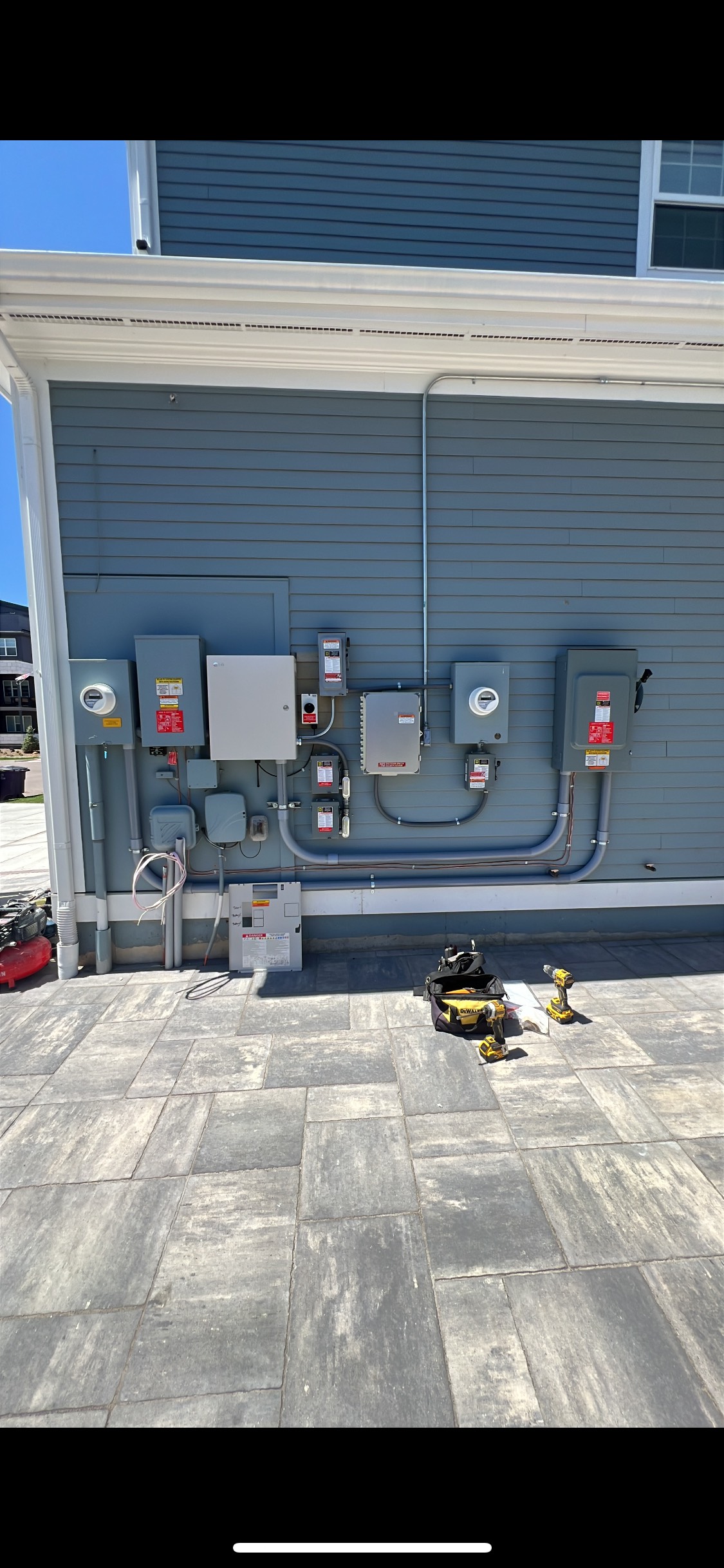 Solar panel installation team working on a residential roof in [City, State]